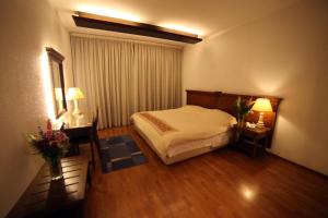 Cama o camas de una habitación en Holiday Home Suites