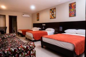 Tempat tidur dalam kamar di HM International Hotel