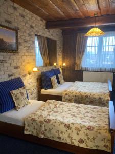 Кровать или кровати в номере Penzion Aurooms