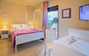 Posteľ alebo postele v izbe v ubytovaní Marini Luxury Apartments and Suites
