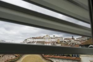 a view of a city from a window at Avenida Central - Coimbra Accommodation in Coimbra