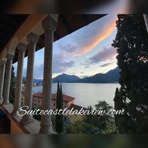 a view of the lake from the balcony of a house at Suitecastlelakeview 1 in Bellano