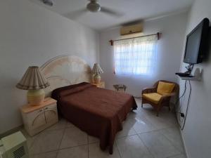Giường trong phòng chung tại Mima's Village Cozumel