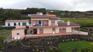 an aerial view of a house at Apartamento Bela Vista Ilha Terceira in Feteira +24 photos