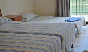 A bed or beds in a room at Kkaras Hotel 3 Star