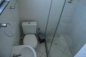 a bathroom with a shower and a toilet and a sink at Brasil mulato in Salvador