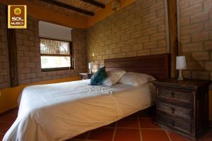 Säng eller sängar i ett rum på Cabaña Campestre Sol Muisca RNT85322