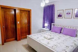Ένα ή περισσότερα κρεβάτια σε δωμάτιο στο Hermoso apartamento, 3 Habitaciones espaciosas, 2 Aires acondicionados