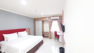 Kama o mga kama sa kuwarto sa Moritz Hotel RSAB Harapan Kita