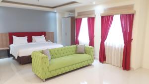Kama o mga kama sa kuwarto sa Moritz Hotel RSAB Harapan Kita