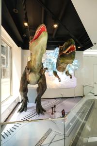a dinosaur model on display in a museum at Henn na Hotel Seoul Myeongdong in Seoul
