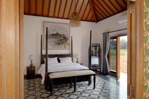 Tempat tidur dalam kamar di Bhumi Kasuryan Borobudur