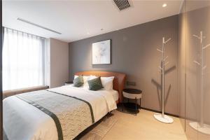 Ліжко або ліжка в номері Cresasia Residence