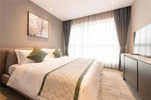 Ліжко або ліжка в номері Cresasia Residence