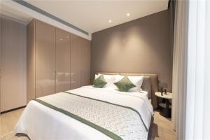 Ліжко або ліжка в номері Cresasia Residence