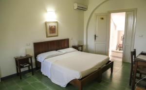 En eller flere senge i et værelse på Barone GR Macrì Agriturismo Modi