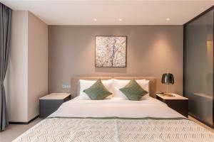 Ліжко або ліжка в номері Cresasia Residence