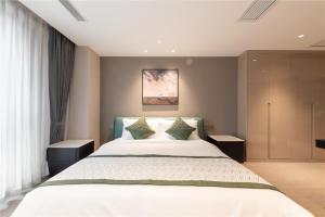 Ліжко або ліжка в номері Cresasia Residence