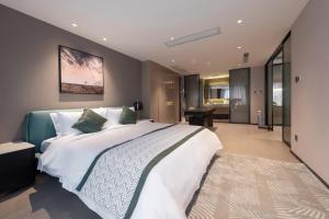 Ліжко або ліжка в номері Cresasia Residence