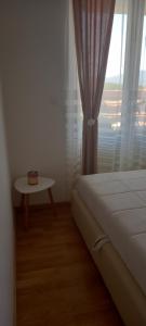 Postel nebo postele na pokoji v ubytování Apartman Ramonda Vrnjacka banja