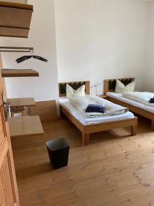 En eller flere senge i et værelse på Gutshaus mit Seeblick - ökologisch & nachhaltig