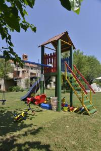 a playground with a slide and a play structure at Villa Vodnjan (3556) in Vodnjan