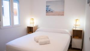 Postel nebo postele na pokoji v ubytování APARTAMENTO JUNTO A LA PLAYA DE BENIDORM