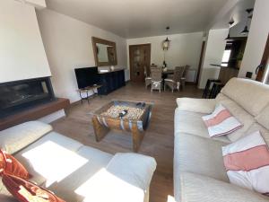 a living room with a couch and a coffee table at Casa La Pedrana in Chía