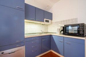 Köök või kööginurk majutusasutuses Feriendorf Rugana - Klassik Appartement mit 1 Schlafzimmer B40