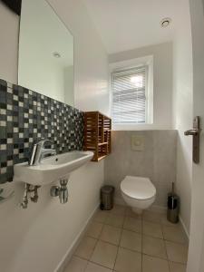a bathroom with a sink and a toilet at Villa beaupré les Issambres Roquebrune sur argens, frejus in Les Issambres +31 photos