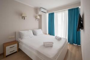 Postel nebo postele na pokoji v ubytování Orbi Beach Tower Hotel Official