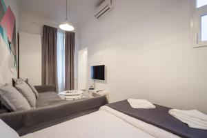Posteľ alebo postele v izbe v ubytovaní BpR Art of Rainbow Apartments