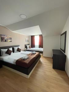 Ένα ή περισσότερα κρεβάτια σε δωμάτιο στο Panorama apartments