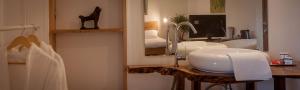 a bathroom with two sinks and a mirror at Elma Guesthouse in Alba Iulia