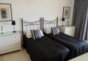 Ένα ή περισσότερα κρεβάτια σε δωμάτιο στο Luxury Apartment in Los Boliches