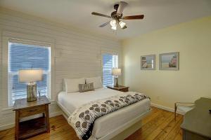 a bedroom with a bed and a ceiling fan at Moon Song 515 WAC in Port Aransas