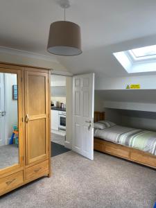 a bedroom with a bed and a skylight at The Hawthorne in Lees