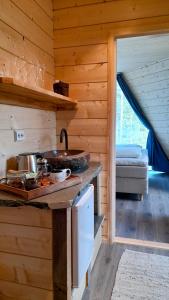 a kitchen in a wooden cabin with a counter top at Trasti & Trine Boutique Hotel in Alta