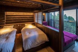 Postel nebo postele na pokoji v ubytování Hakone Kyuan