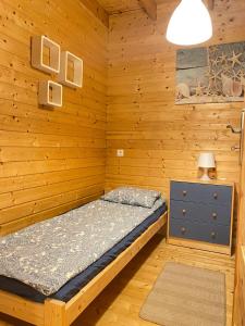 Postel nebo postele na pokoji v ubytování Słoneczny Zakątek Słajszewo