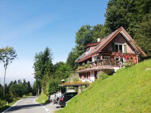 a house on the side of a hill at 1 ZI Appartement Zauberwald in Bildstein