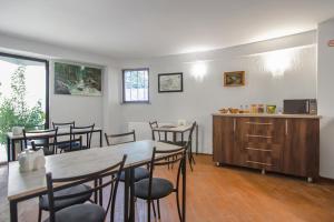 a dining room with a table and some chairs at Hotel "Elesa Wera" in Tbilisi City