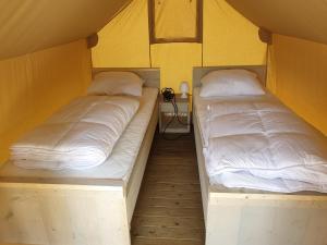 Posteľ alebo postele v izbe v ubytovaní Safaritent Mini Lodge