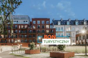 a rendering of a building with a sign in front of it at Absyntapart - Bulwar Staromiejski in Wrocław