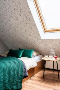Posteľ alebo postele v izbe v ubytovaní Absynt Hostel Wrocław
