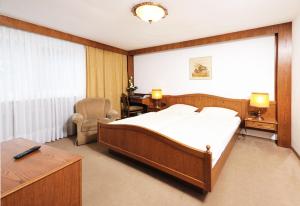 Postel nebo postele na pokoji v ubytování Hotel Alte Post Garni + 18 fotografií