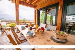 a wooden table with food on top of a house at Chalet Caprice in Combloux