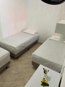 Un pat sau paturi într-o cameră la Casa Frida Aracaju a 500m da praia
