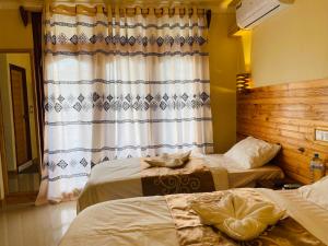 Postel nebo postele na pokoji v ubytování Mariana Maldives