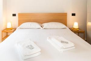 Posteľ alebo postele v izbe v ubytovaní Stylish Quardilatero Romano Central Flat